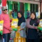 Bupati Touna, Ilham Lawidu Hadir Sekaligus Menyerahkan Secara Simbolis Bantuan Beras.