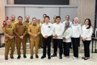 Bupati Touna, Ilham Lawidu Saat Foto Bersama Dengan Tim BPK RI Perwakilan Sulteng Usai Melaksanakan Kegiatan Exit Meeting.