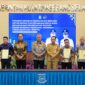 Bupati Ilham Lawidu saat menghadiri penandatanganan kesepakatan bersama antar daerah dan perjanjian kerjasama replika sistem integrasi geospasial informasi tanah dan pajak di Puspemkot Tangsel.